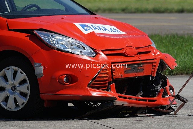 Real Shot of Red Ford Sedan Crash Test - Material Related to Auto Insurance Claims