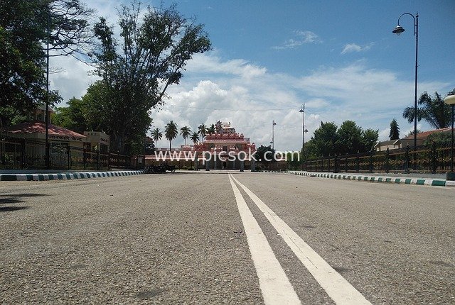 Religious Temple and Road Landscape Under Blue Sky and White Clouds