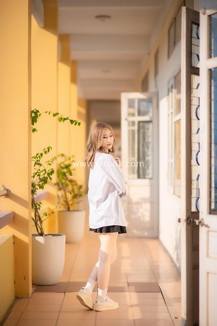 Sunset at Vietnamese Campus: Youthful Portrait of a Young Girl