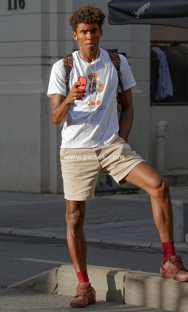 African-American Man Relaxing on the Street – A Moment of Urban Outdoor Life