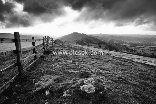 Peak District Black-and-White Landscape: Wooden Fence, Stone Path, Distant Mountains and Cloudscape