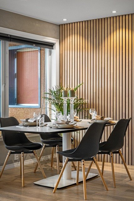 Modern Light Luxury Dining Room with Wooden Walls, Black Dining Chairs & Table Setting