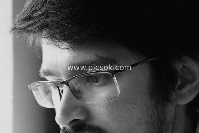 Black and White Close-up Portrait of a Pensive Man with Melancholic Eyes