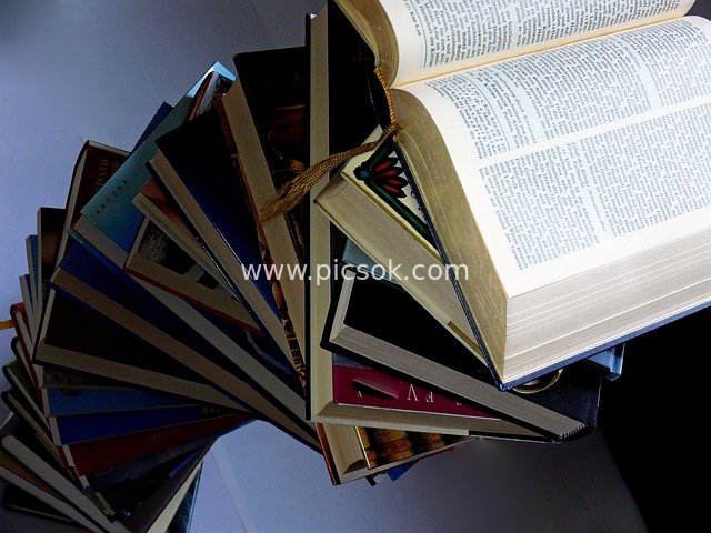 Stacked Books and an Open Book – Reading & Learning Material