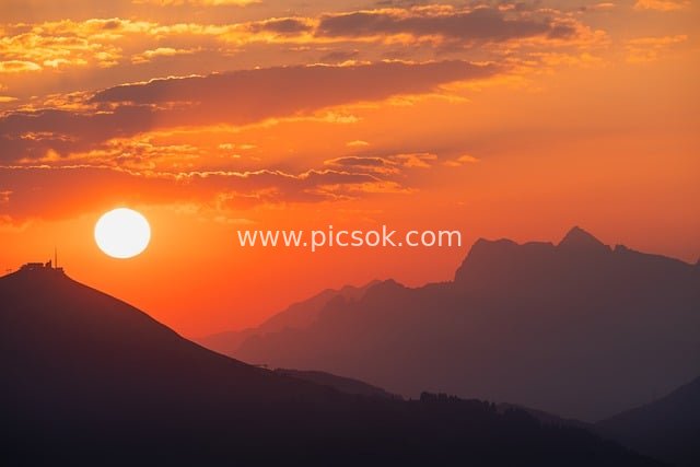 Magnificent Sunset Mountain Landscape with Orange-Red Sky Wallpaper Material