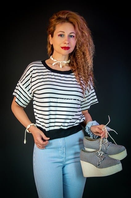 Curly-Haired Model in Casual Outfit: Striped T-Shirt & Platform Shoes Fashion Shoot