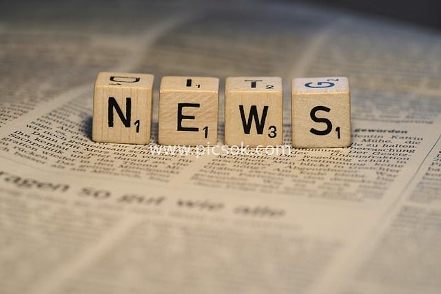 Wooden Blocks Spelling 'NEWS' on Newspaper Background - News Design Material