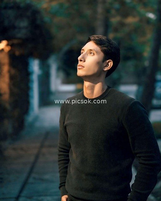 Fashion Portrait of a Handsome Man on Outdoor Street in Black Sweater