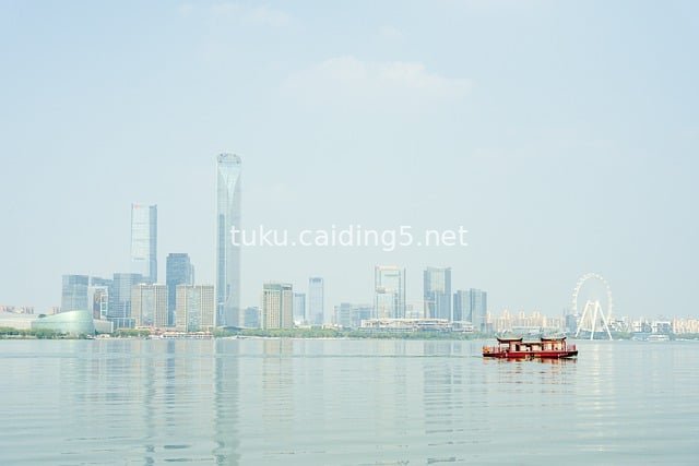 Modern Urban Skyline and Cruise Ship Scenery of Suzhou Jinji Lake