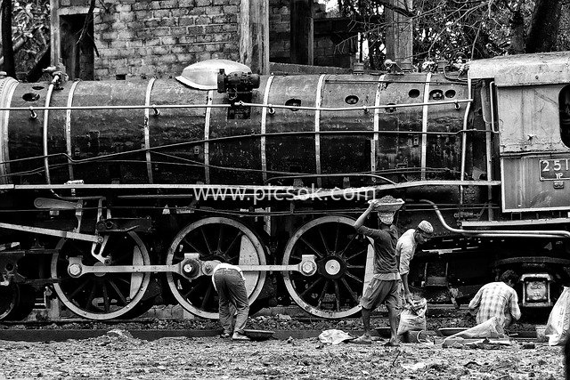 Black-and-White Documentary of Indian Railway Workers Repairing Vintage Steam Trains