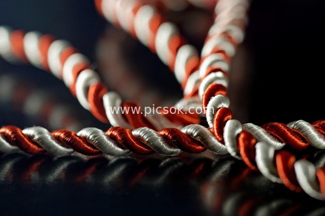 Close-up of Eastern European Traditional Martisor Red and Silver Silk Braided Rope