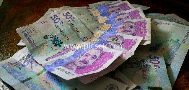 Scattered Colombian Peso Banknotes - Financial and Economic Material Image