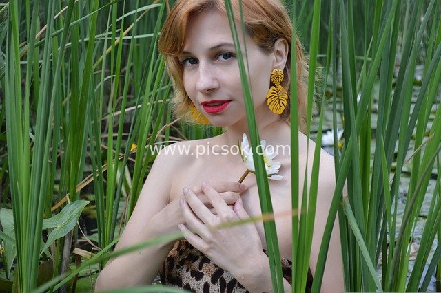 Portrait of a Woman by Natural Water Among Water Lilies and Reeds