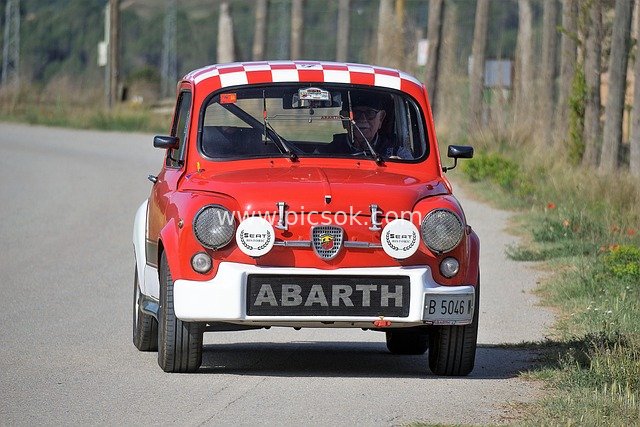 Red Vintage ABARTH Classic Car Driving on a Country Road