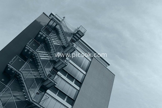 Metal Fire Escape Ladder of Modern Building: Upward Perspective Photography Material