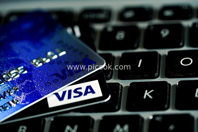 Visa Credit Card and Laptop Keyboard – Online Payment Scenario