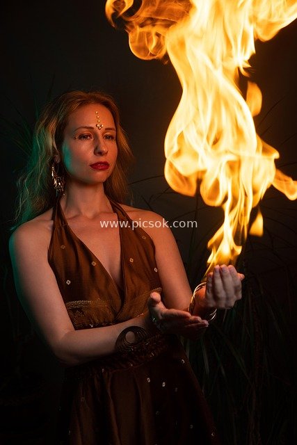Fantasy-Style Female Fire Performance & Magical Witch-Themed Portrait