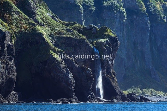 Natural Landscape of Coastal Cliff Waterfall in Hokkaido, Japan