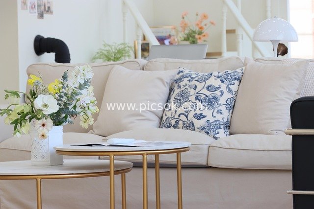 Cozy Living Room with Beige Sofa and Exquisite Soft Furnishings