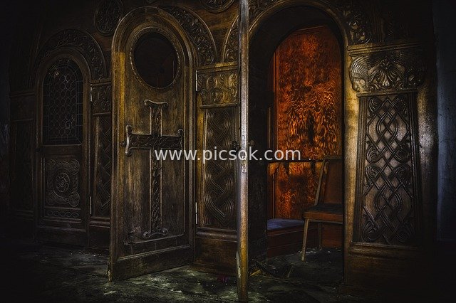 Abandoned Medieval Church Interior: Religious Atmosphere & Wooden Carvings