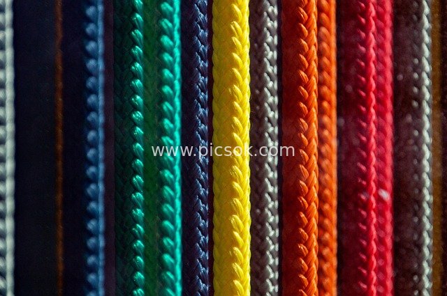 Close-up of Colorful Braided Ropes: Color Showcase of Handmade Weaving Materials