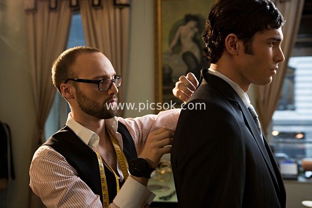 Tailor Adjusting Custom Suit for Client in Fashion Studio