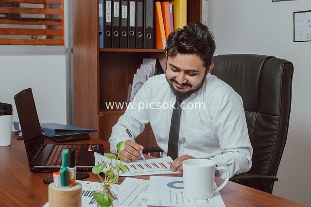 Businessman Focused on Work in Office – Professional Workplace Scene