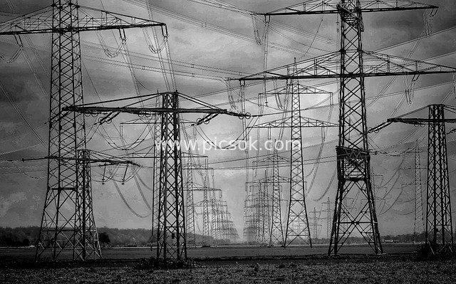 Black and White Group of High-Voltage Transmission Towers in Stormy Weather - Energy Technology Power Facilities