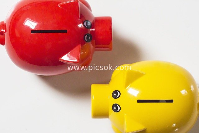 Red and Yellow Piggy Banks - Financial Material Image for Savings and Wealth Management