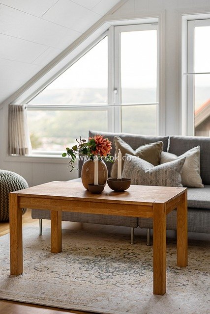 Nordic Attic Living Room with Wooden Furniture and Natural Window Views