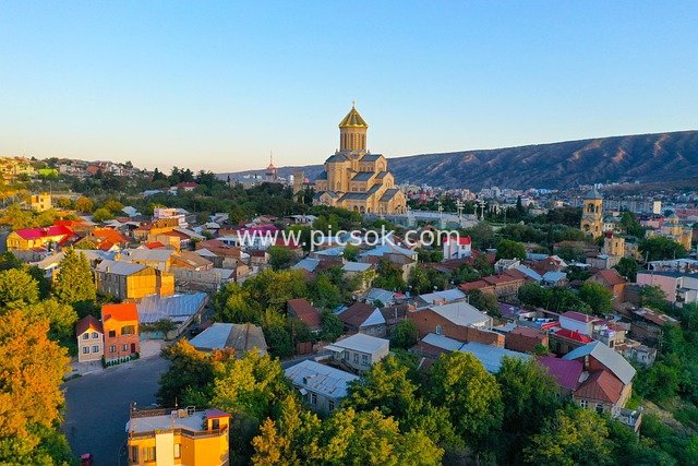 Orthodox Church and Colorful-Roofed Houses in a Georgian Town