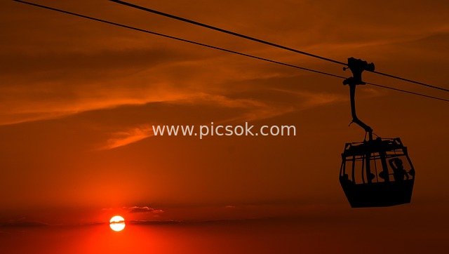 日落黄昏缆车剪影 浪漫天空下的交通风景