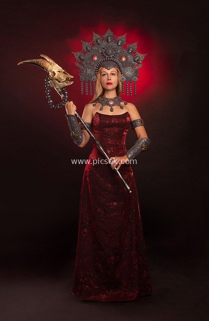 Fantasy Witch Cosplay: Magical Attire with Red Dress and Skull Scepter