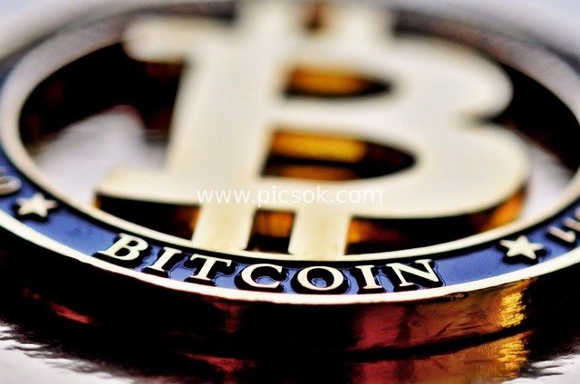 Close-up of Bitcoin Physical Coin - Cryptocurrency Financial Investment Material