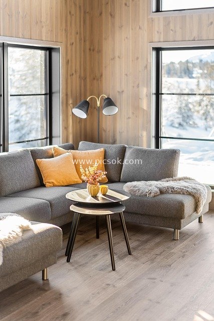 Modern Cozy Living Room with Wooden Walls and Snow-View Floor-to-Ceiling Windows