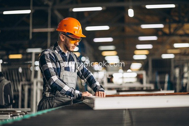 Factory Worker Concentrating on Work in Workshop – Real Shot of Industrial Production Site