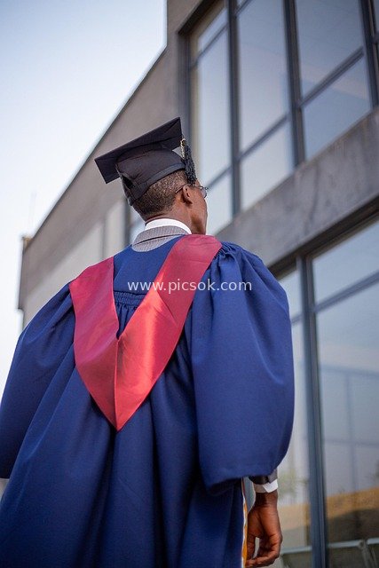 African Male Graduate in Academic Gown: Graduation Success Moment