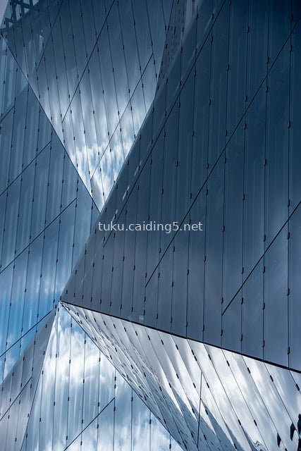 Modern Glass Curtain Wall Building: Fashionable Design Structure with Blue Sky Reflections