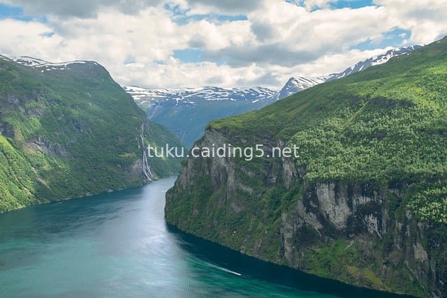 Natural Landscape of Norwegian Fjords: Snowy Peaks, Waterfalls and Emerald Waters