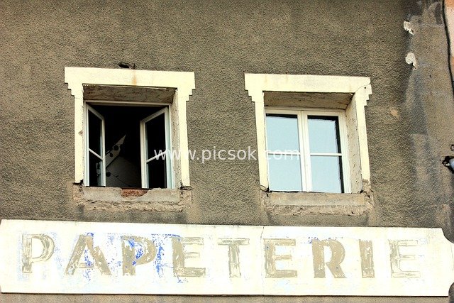 Old Town Stationery Shop Sign and Weathered Building Windows