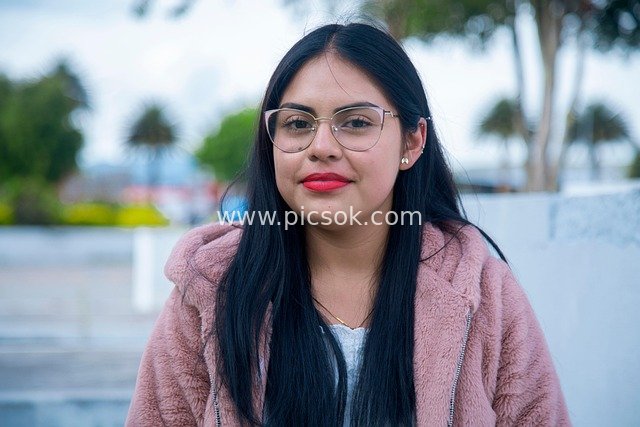 Beautiful Portrait of a Young Female Student in an Outdoor Park