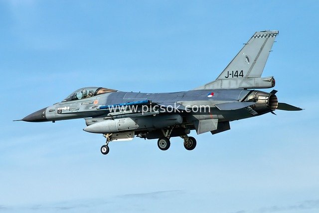 Dutch F-16 Fighting Falcon in Flight – Close-Up of Military Aviation Against Blue Sky