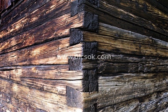 Detailed View of Dovetail Joint Structure in Weathered Old Wooden Cabin