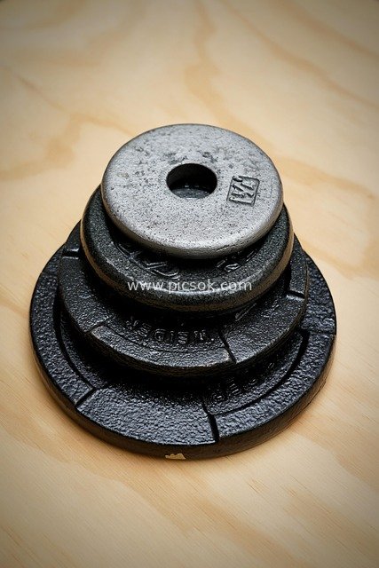 Stacked Dumbbell Plates - Gym Strength Training Equipment