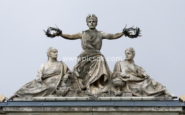 Classical Stone Sculpture Ensemble atop an Old Urban Building