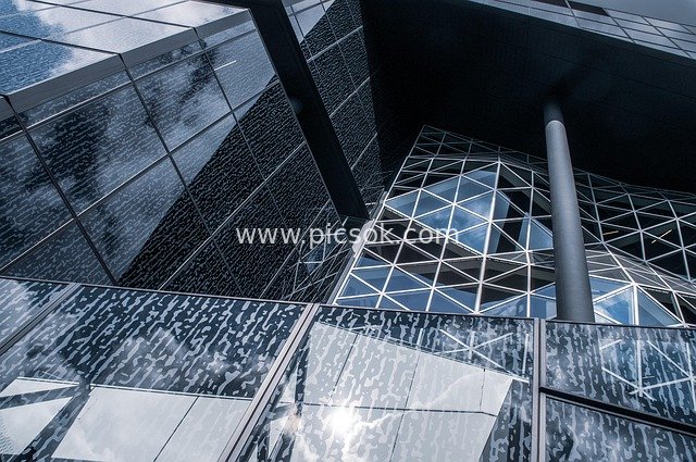 Modern Glass Curtain Wall Building with Geometric Structure and Light & Shadow Design