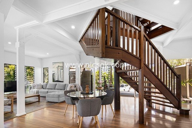 Modern Luxurious Living Room with Wooden Staircase and Bright Home Design