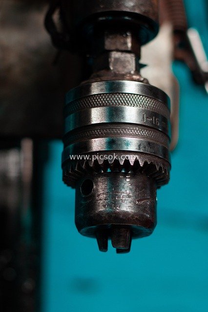 Close-up of Drill Chuck in Industrial Workshop - Maintenance Tool Detail Material
