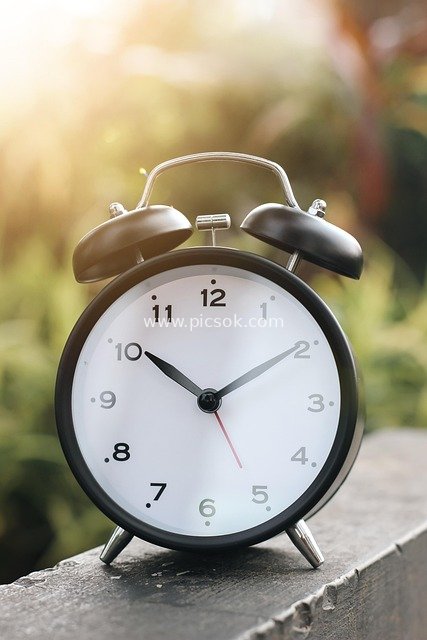 Classic Black Analog Alarm Clock Outdoor Sunshine Time Management Image Material
